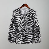 Affluent Zebra V-neck Blouse
